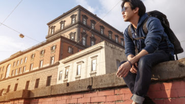 Asian backpacker man traveling in Italy, Europe