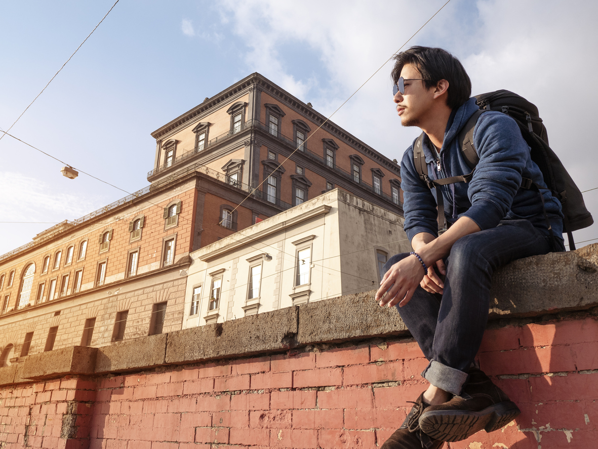 Asian backpacker man traveling in Italy, Europe